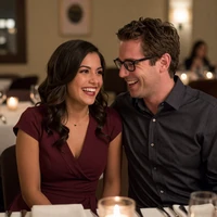 David and Elena sharing a laugh at an upscale restaurant