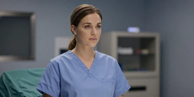 Female nurse anesthetist in scrubs in an operating room setting