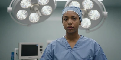 Black surgical nurse in an OR prep area