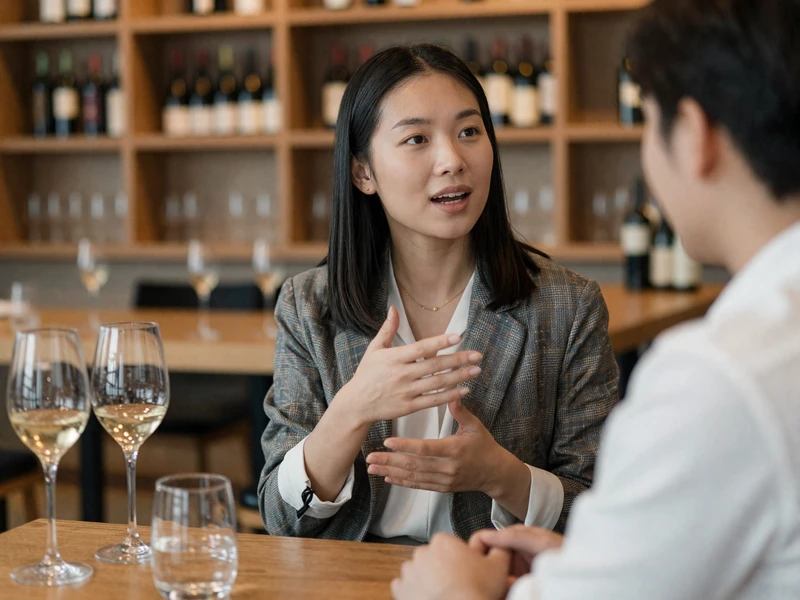 Female doctor engaged in conversation at a modern wine bar